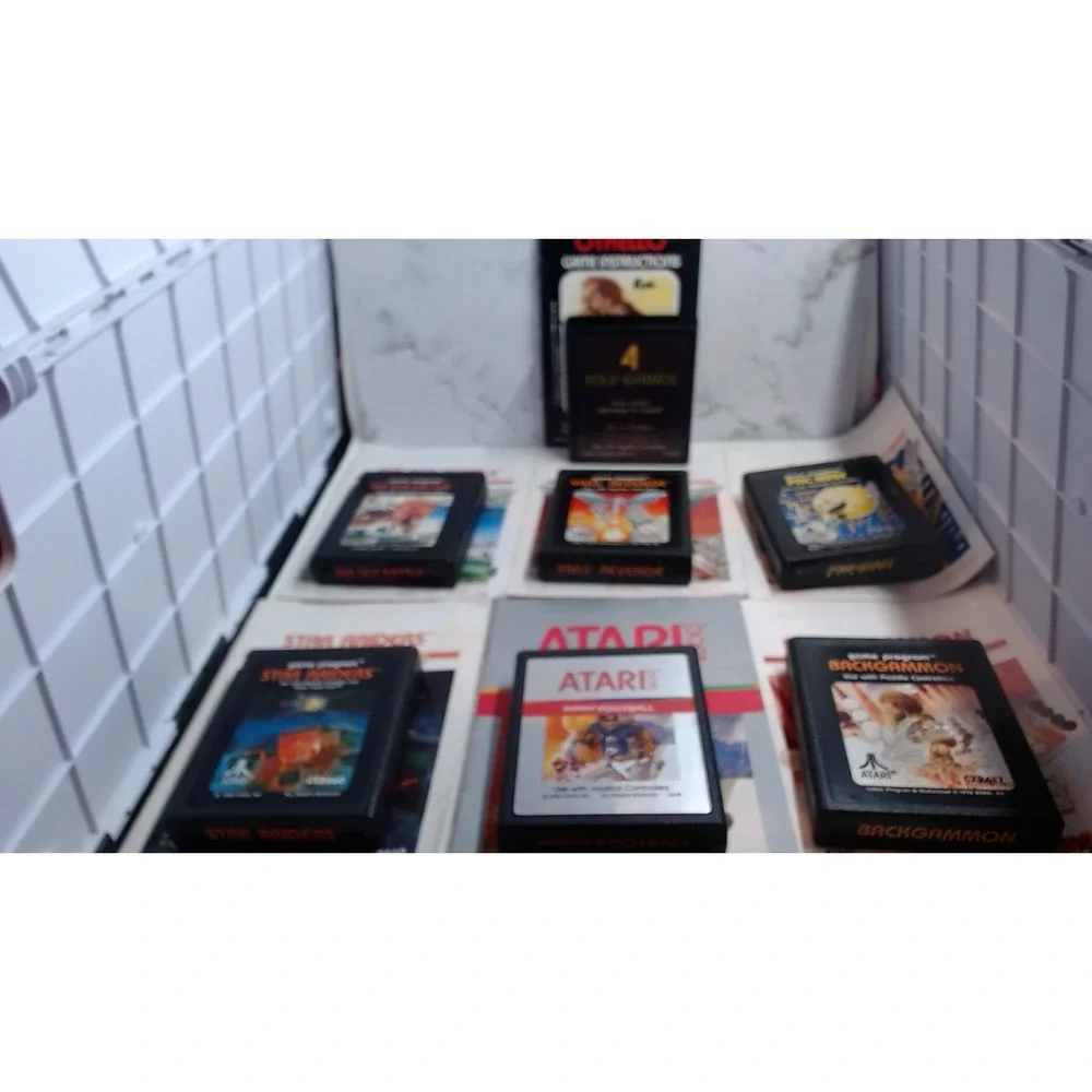 Lot of 7 Atari 2600 Games with Manuals Star Raiders Pac-Man Yars Revenge NTSC